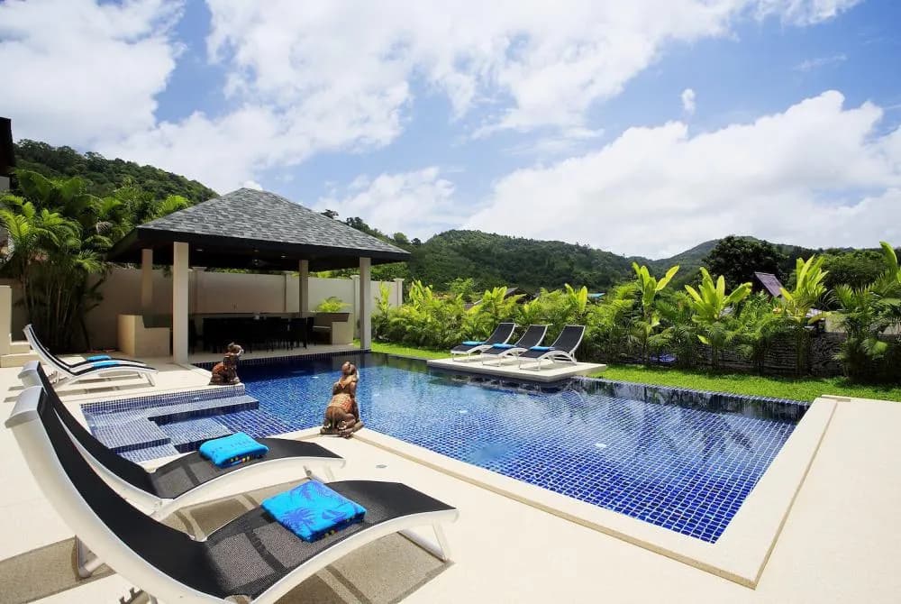 Private swimming pool, surrounded by sunbeds for all guests to relax