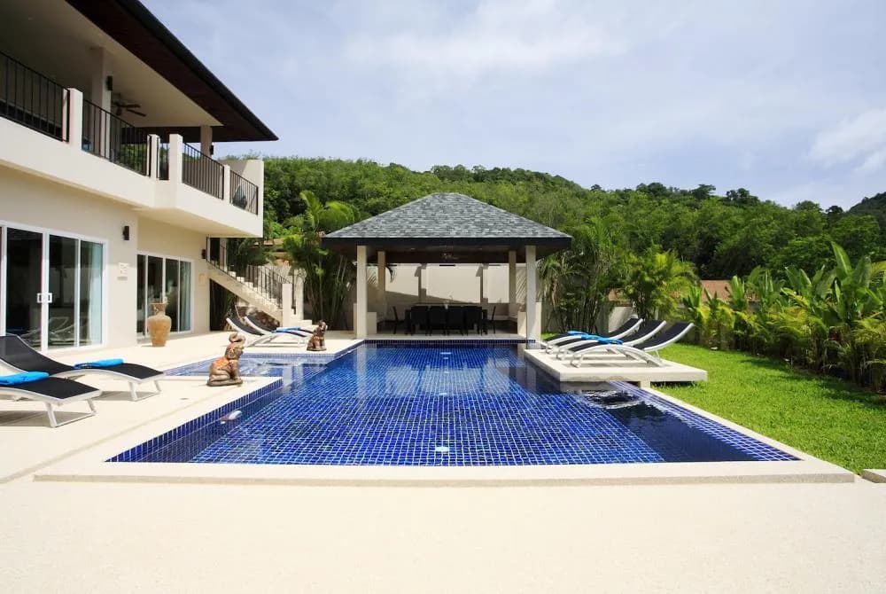 Large private swimming pool, with feature sundeck