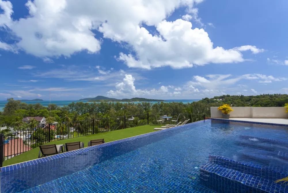 Infinity-edge swimming pool with integral jacuzzi, overlooking the andaman sea
