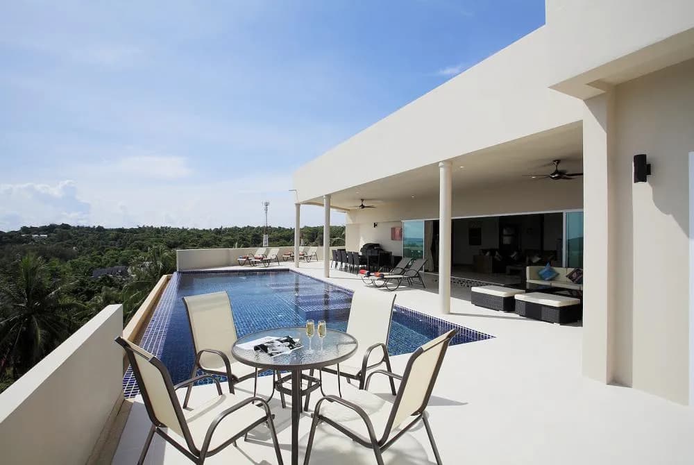 Large sun terrace surrounding the 12 x 5 metre swimming pool