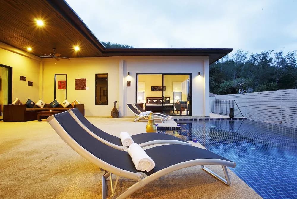 Spacious sundeck with several sunbeds, and inviting private swimming pool